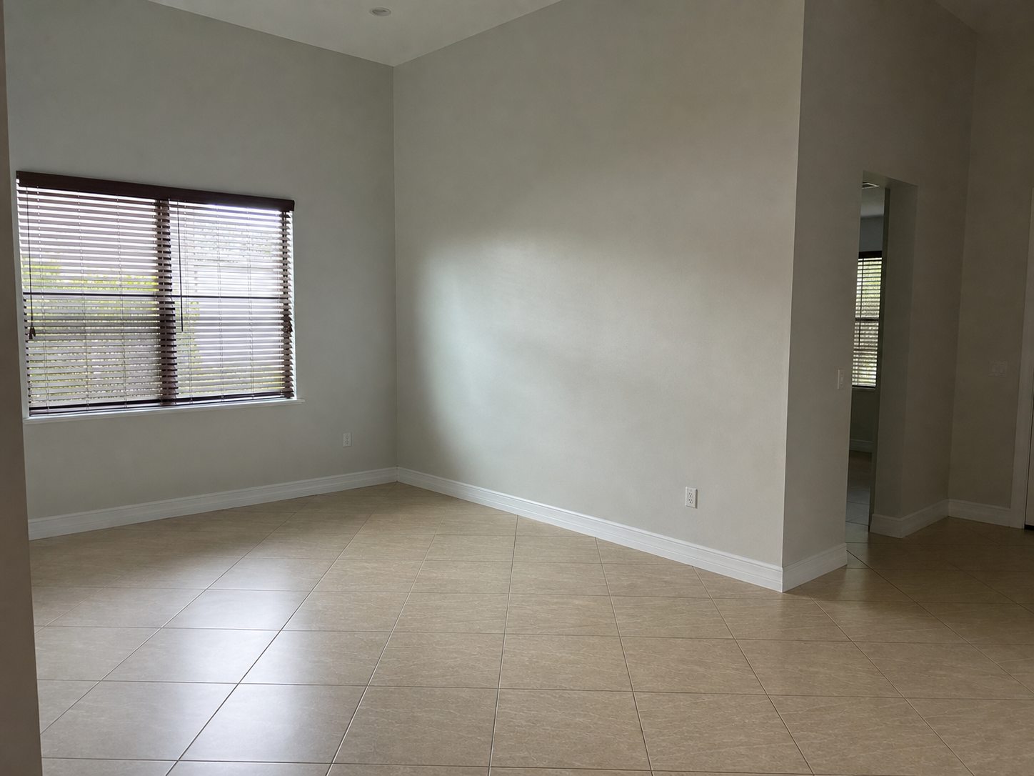 Empty living room after existing furniture was digitally removed
